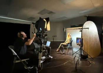 Studio with camera and lighting equipment.