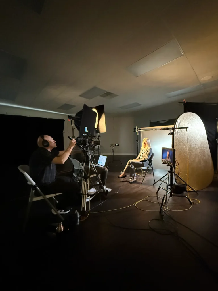Studio with camera and lighting equipment.