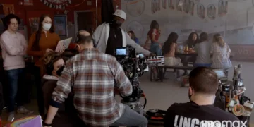 Film crew shooting a scene indoors